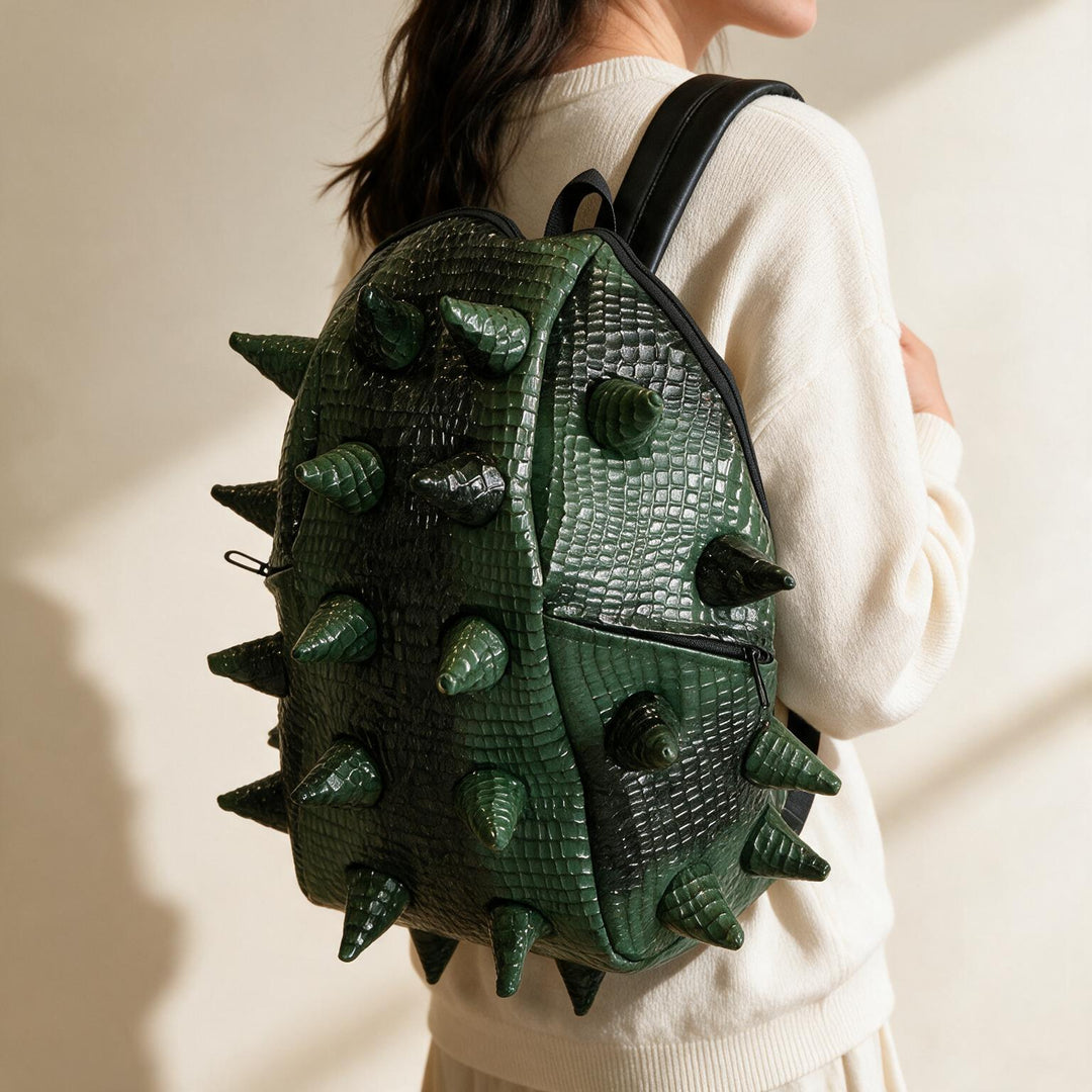 Spiked backpack worn on one shoulder
