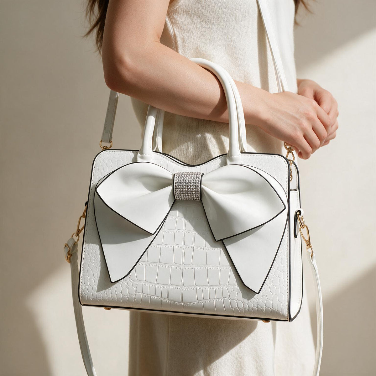 Bow handbag carried at the side