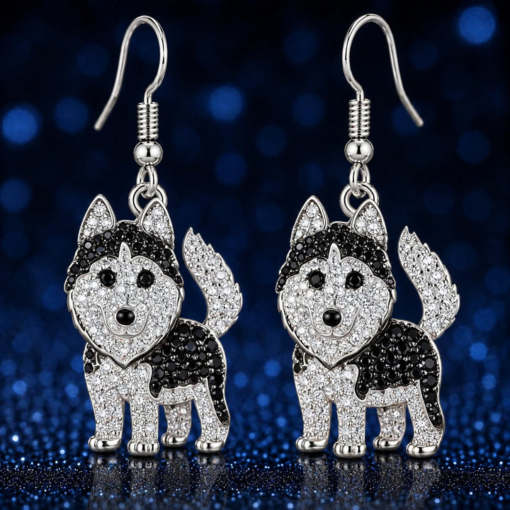 Pair of standing husky rhinestone earrings, French hooks at top, on a dark blue sparkle backdrop