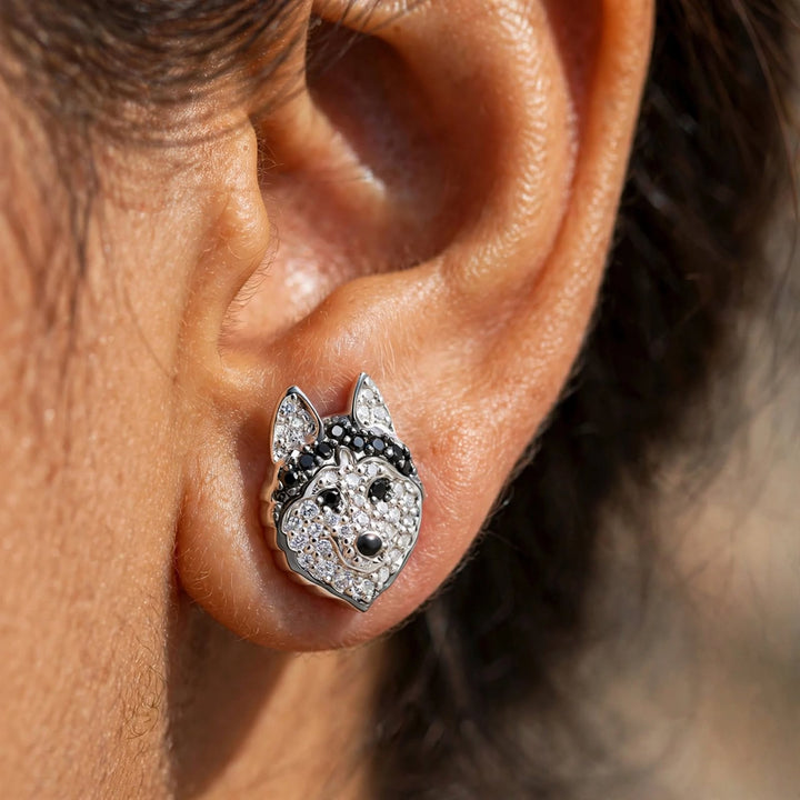 Close-up of a husky stud earring sitting flush on the earlobe