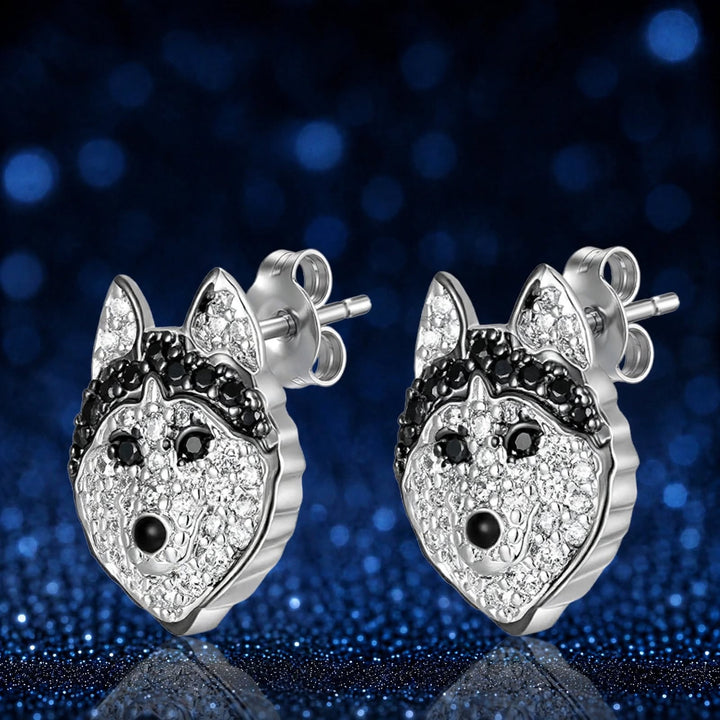 Husky stud earrings, front view of both studs with a black rhinestone brow band and bright black eyes
